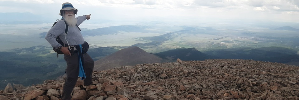 Kelly Carter on summit of Mount Silverheels in Colorado