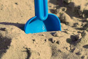 Blue Shovel in Sand